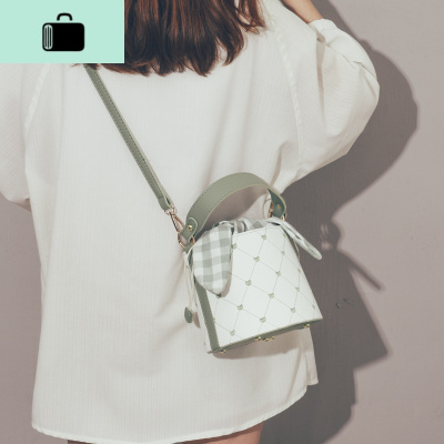 上新质感小包包女2020春款潮韩版百搭斜挎包简约时尚蝴蝶结水桶包NEW LAKE女斜挎包