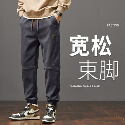 秋冬款休闲裤男宽松潮牌系绳工装裤束脚裤弹力拼接运动裤子